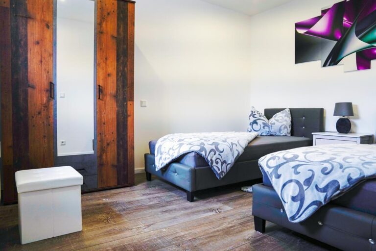Schlafzimmer mit Einzelbetten im HT Appartement Nr. 2